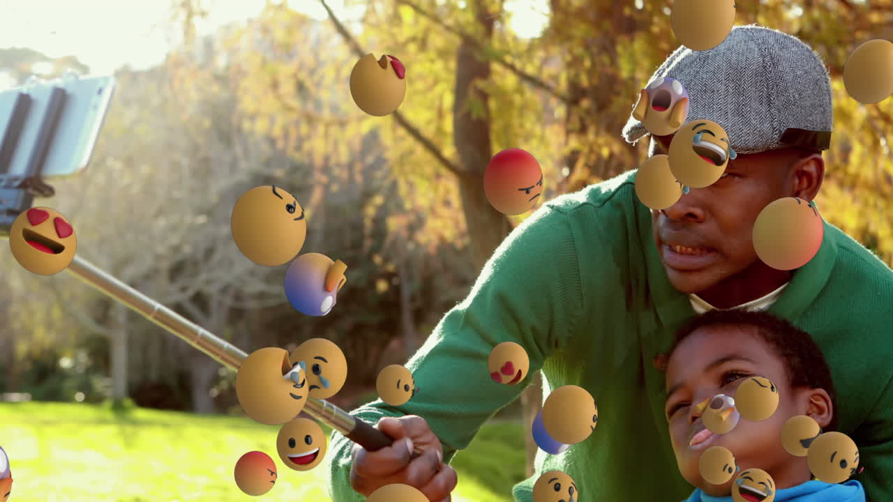 iconos de emoji con padre e hijo tomando una selfie en el fondo 4k