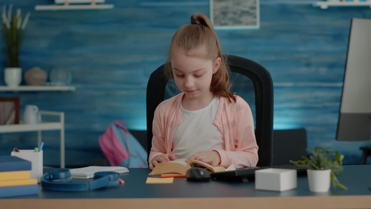 Little child opening book and reading for school classes