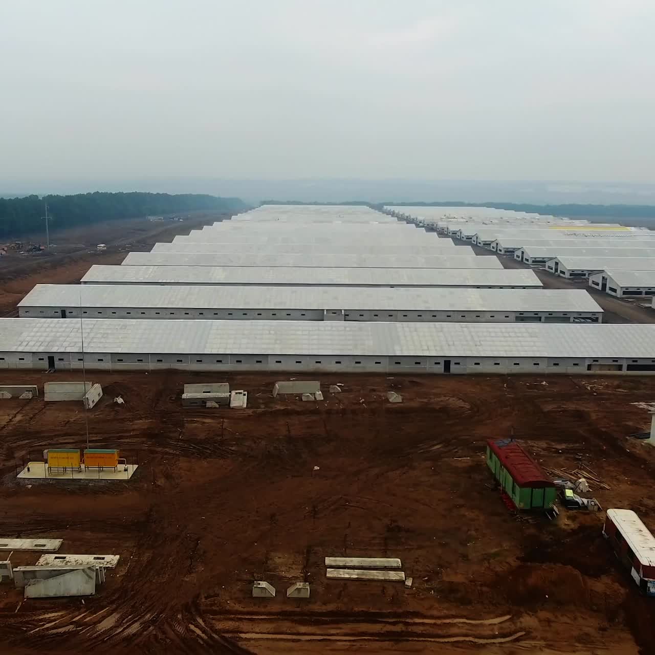 Industrial farm building. Top view of the newly built indusrial zone. Aerial view of hangars in the factory. New modern hangars