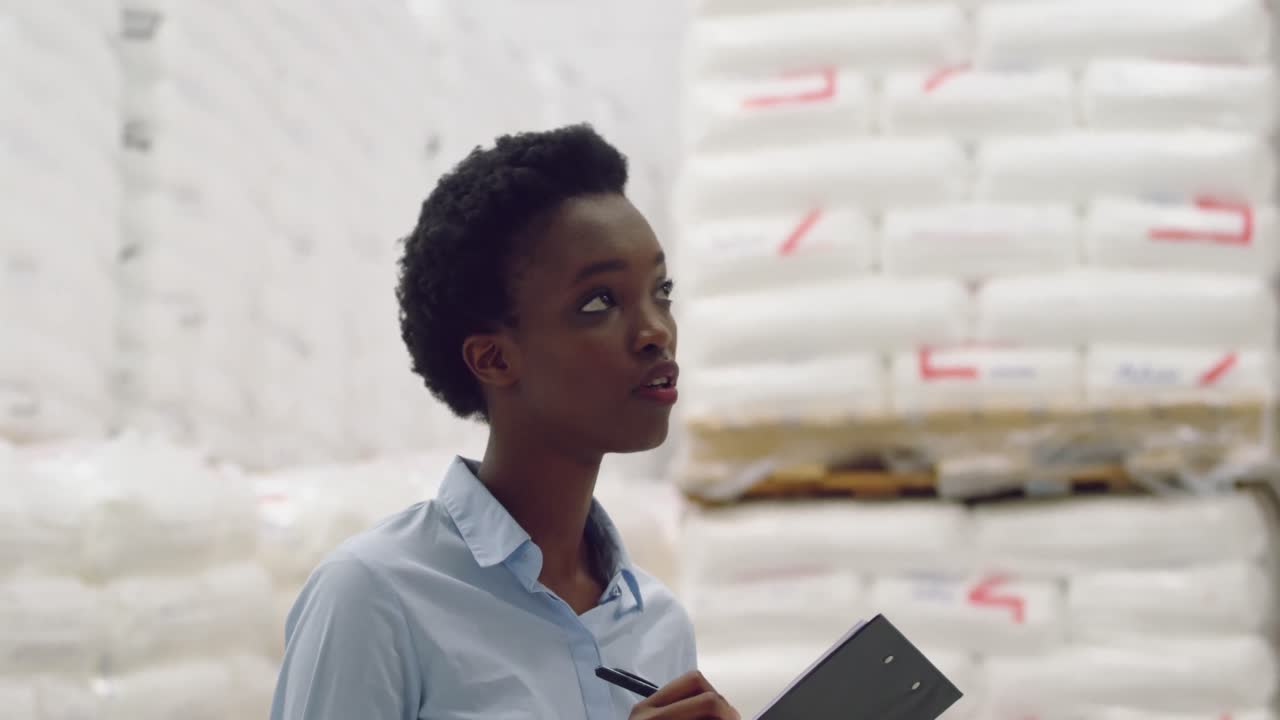 Young female manager in a warehouse