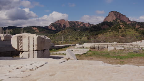 ancient stone ruins of the temple of artemis in front of tmolus mountain in sardis