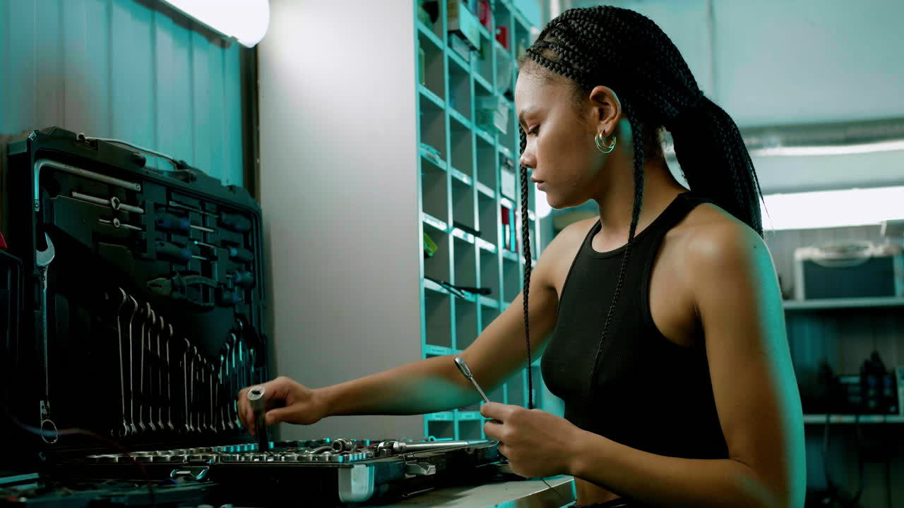 Woman taking tools from toolbox