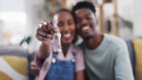 arican couple, hands and keys for new home