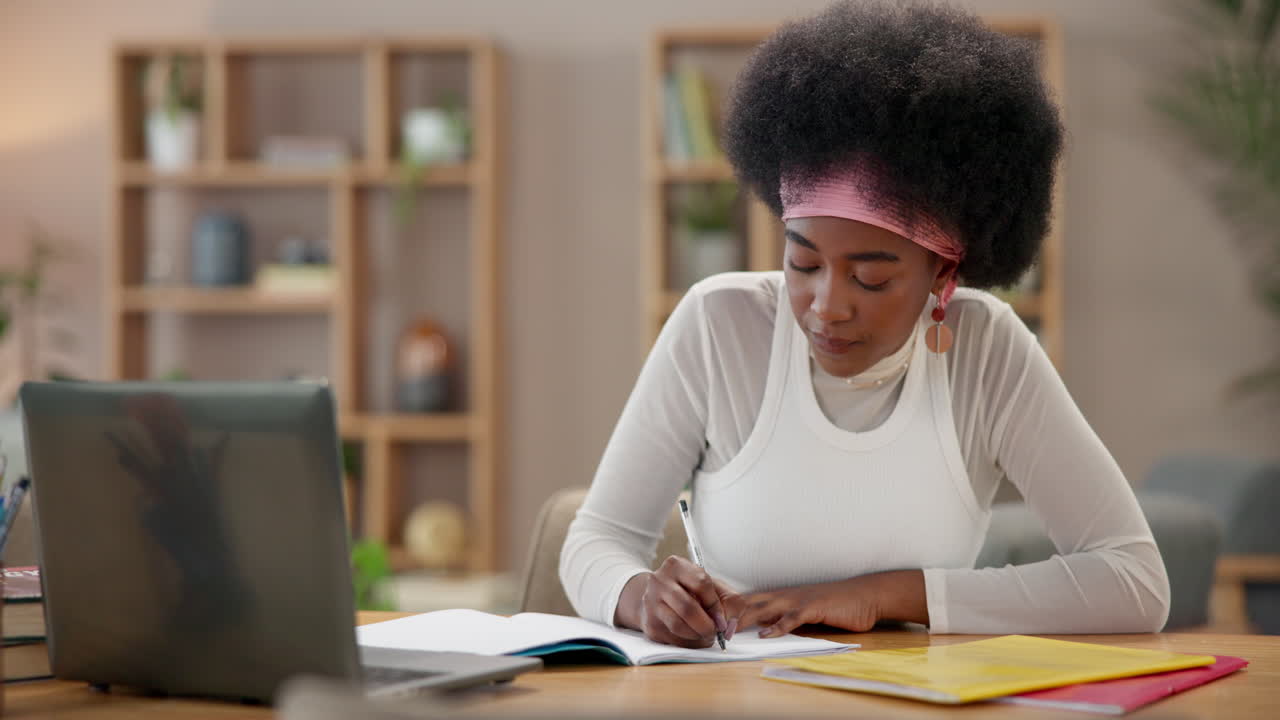 Young woman student studying online at home