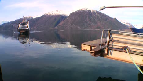 a ferry boat crosses the fjords of norway 1