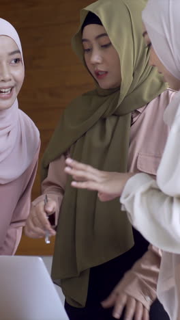 a dynamic, ambitious and upwardly mobile asian muslim entrepreneurs in a startup business meeting, passionately discussing growth strategies for their small business