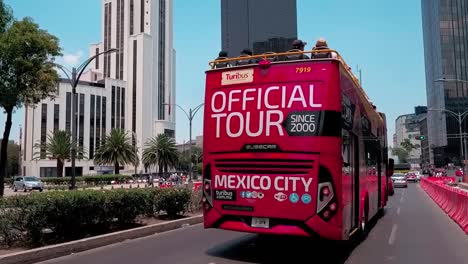 traffic flows on paseo de la reforma, view of caballito monument in mexico city