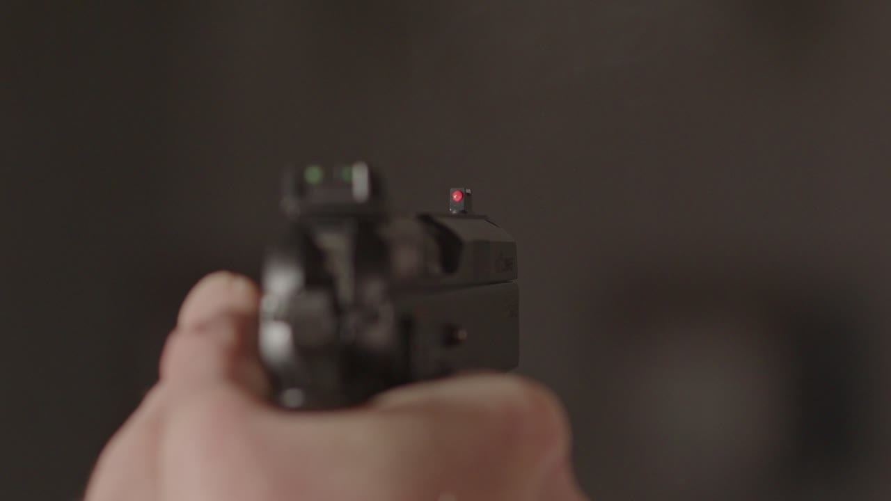 Close up of 9mm pistol firing multiple shots