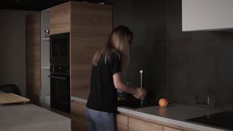 hygiene, health care and safety concept - woman washing fruits and citrus in kitchen at home