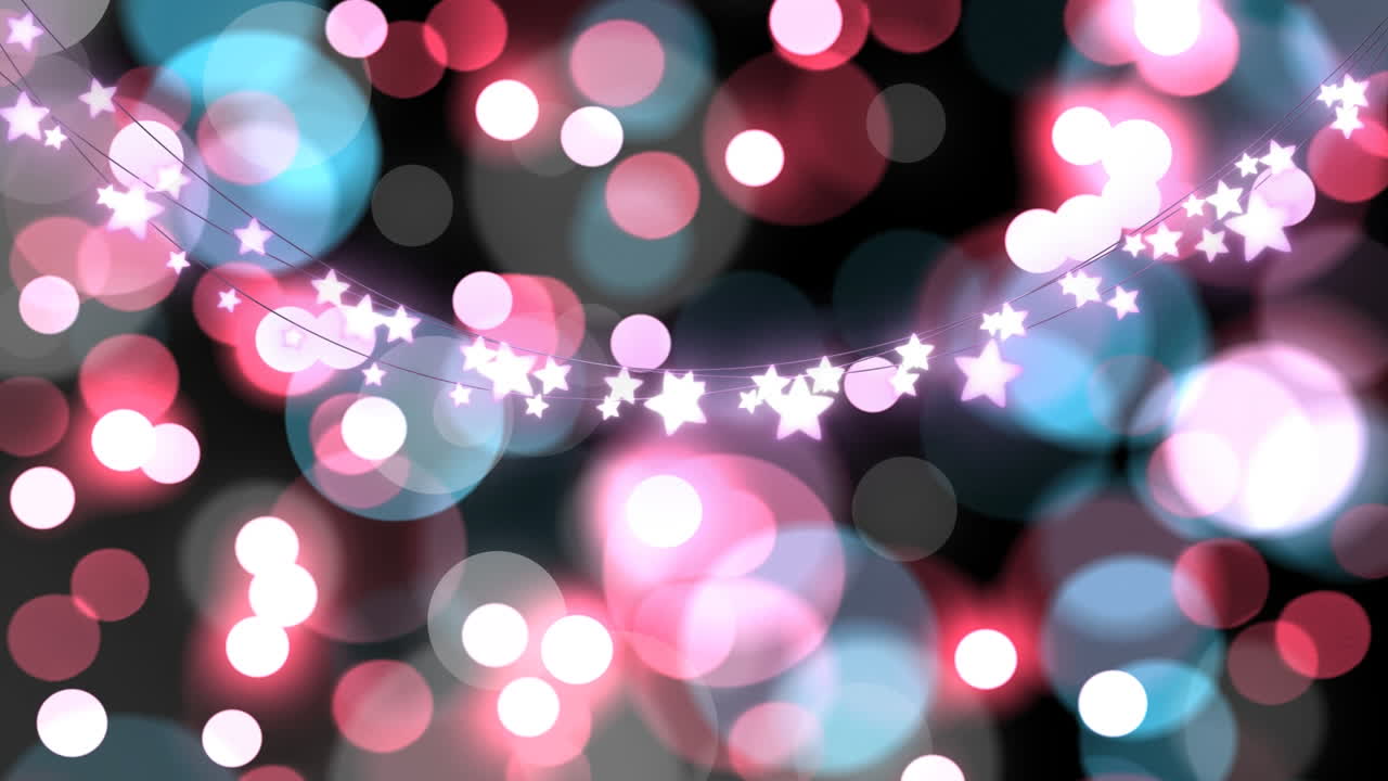 анимация расфокусированных цветных рождественских огней и светящихся звездных струн