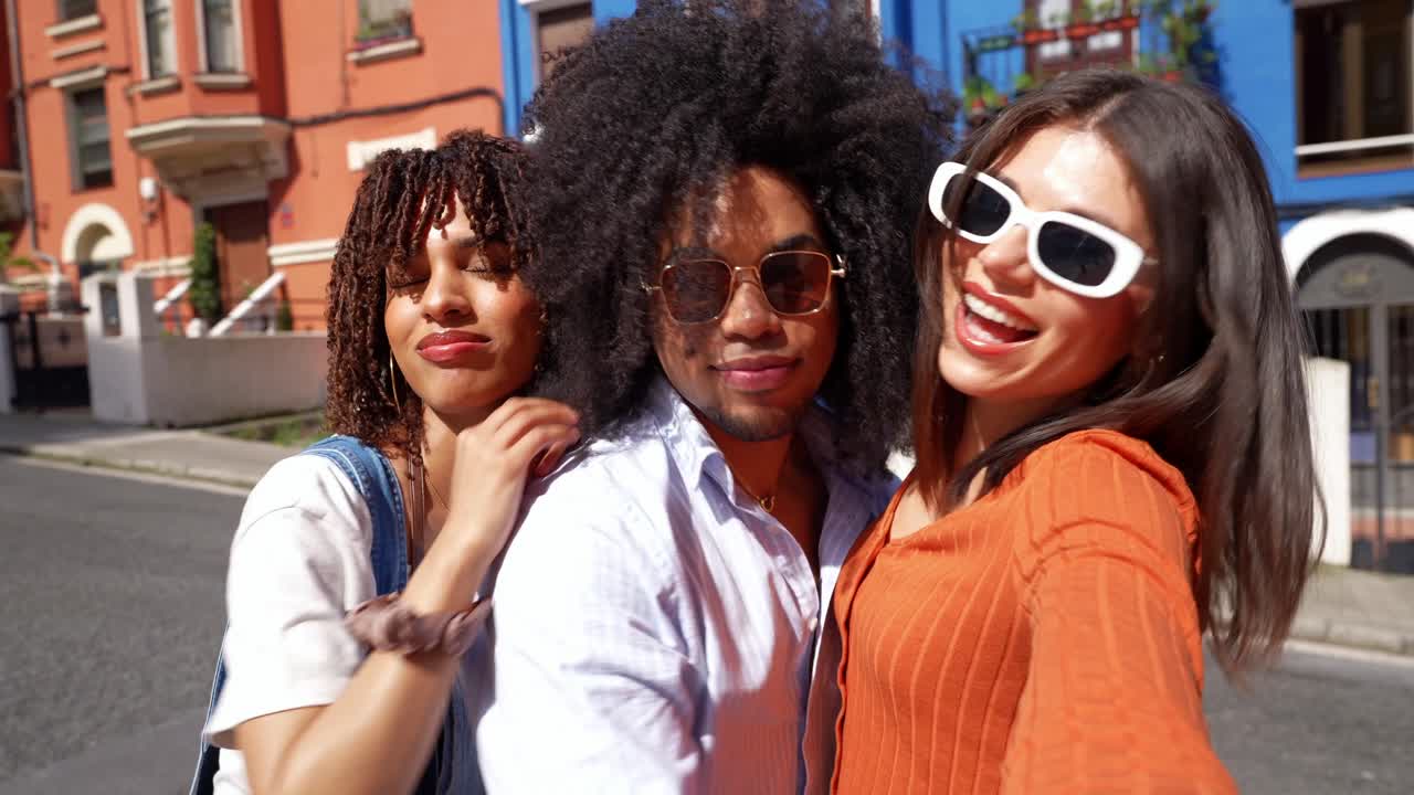 Group of friends taking a selfie on the street