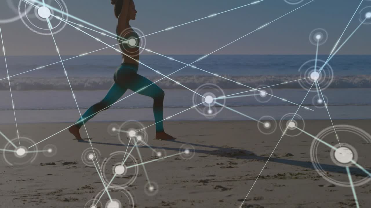Reacting to animated network teal-clad barefoot woman stepping into lunge raising arms on beach