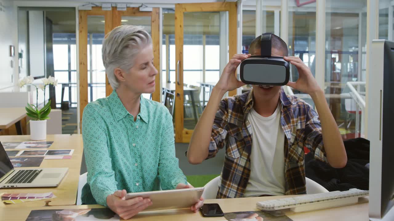 Woman and man working in a creative office