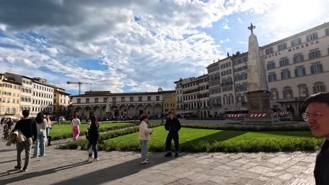 people walking and enjoying the historic square