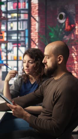 vertical video startup workers team watching business conference on pc monitor