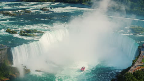 boat by niagara horseshoe waterfall