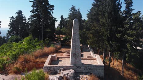 aerial views of a stone monument and historical ruins in a forested park
