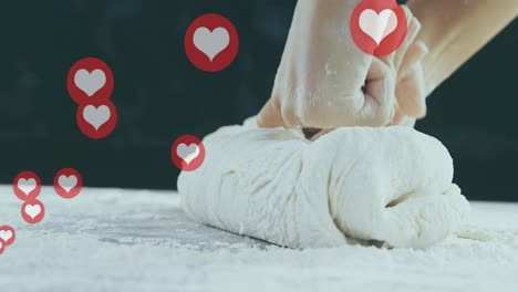 kneading dough with heart icons animation over hands on floured surface