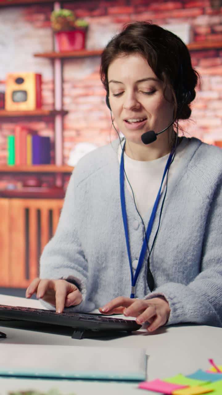 Vertical video Portrait of smiling call center agent next to coworkers tracking shipments