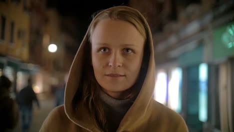 Woman-in-coat-and-cowl-walking-outdoor