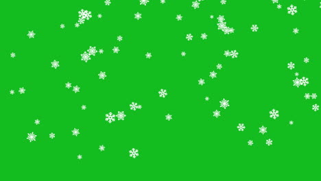 Kleine-Schneeflocken-Unterschiedlicher-Größe-Fallen-Langsam-Auf-Den-Grünen-Hintergrund