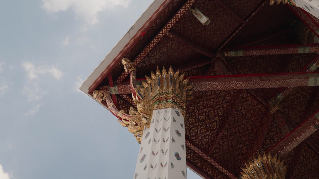 Ornate Thai temple architecture with richly decorated columns