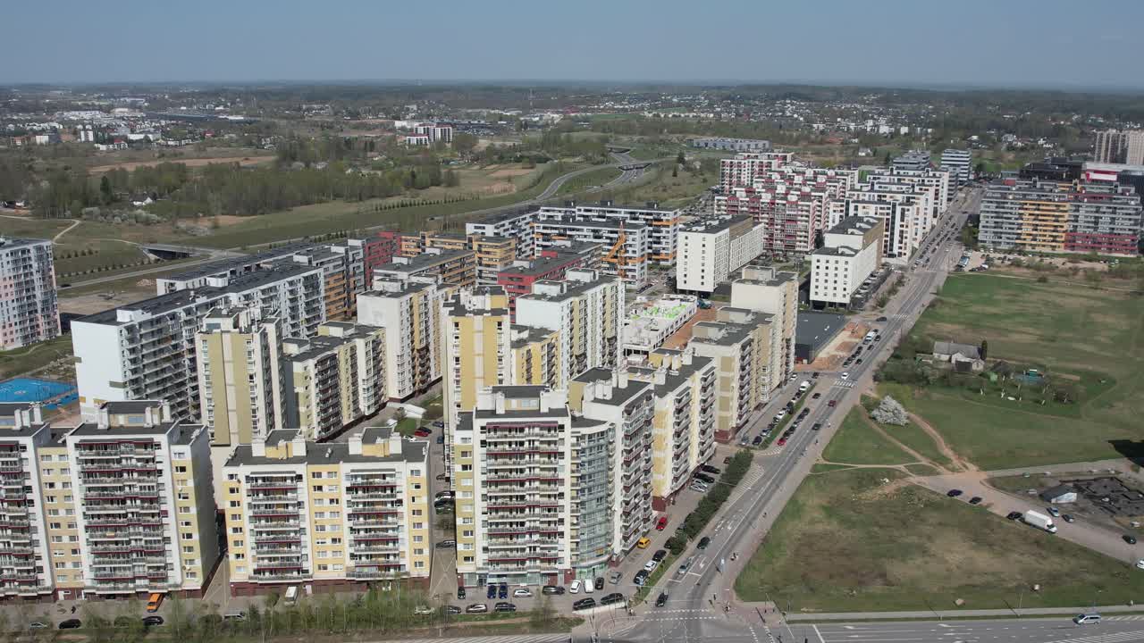 Drone advances over Pašilaičiai showing residential blocks and main roads