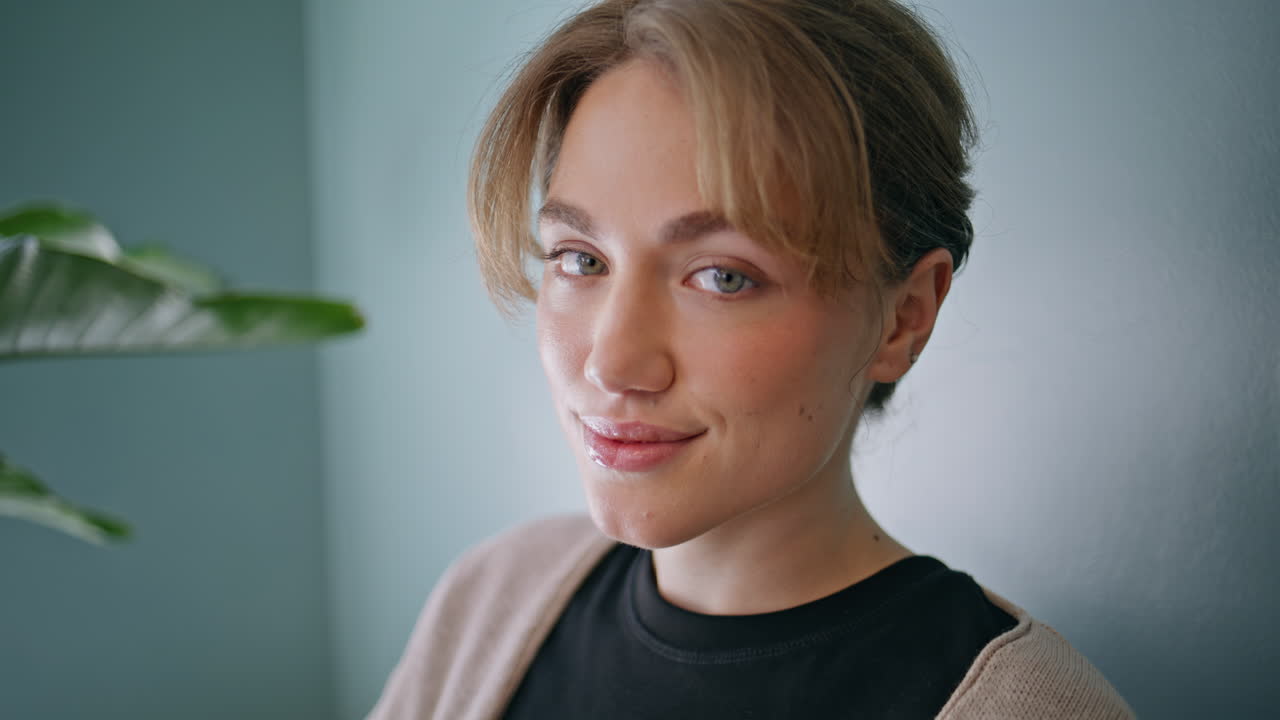 Portrait calm woman smiling in healthcare facility hall. girl patient