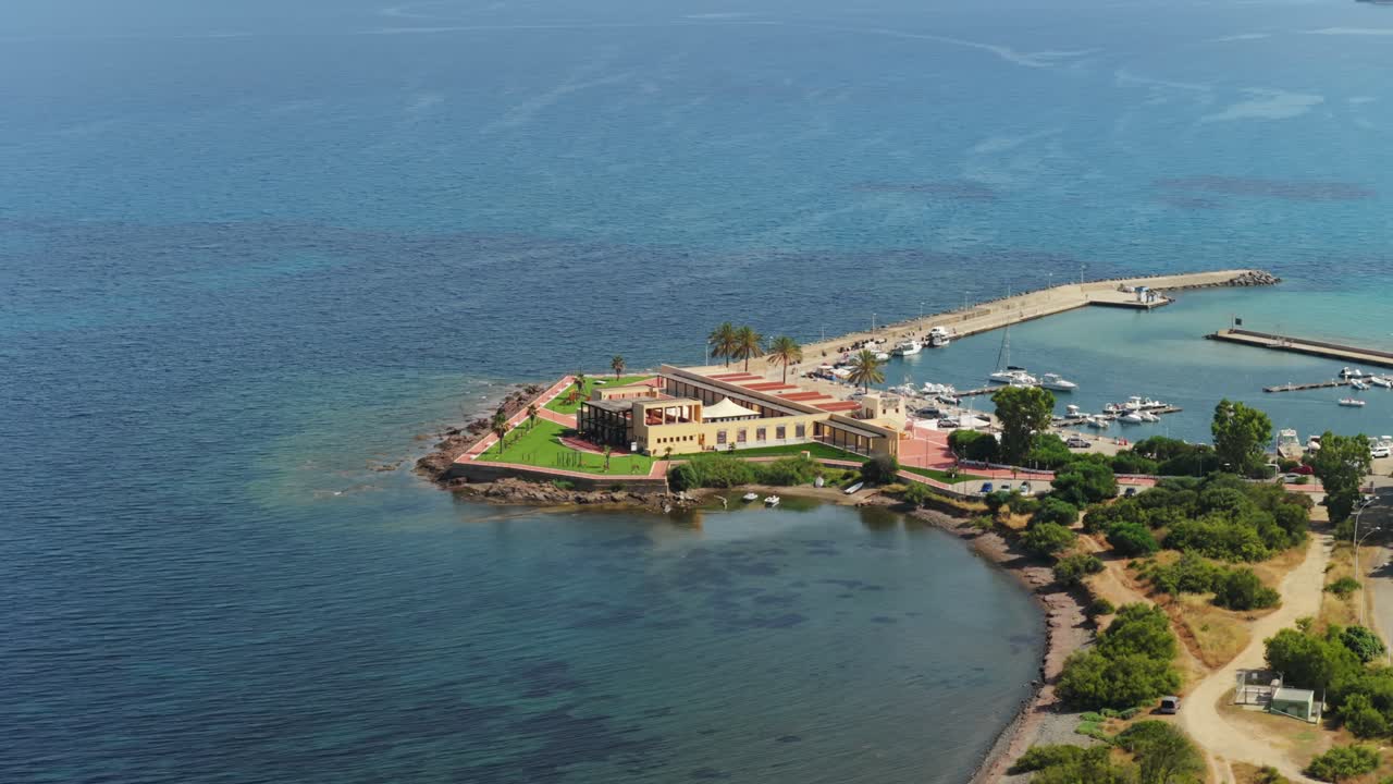 Aerial view of Su Siccu, touristic port of the city of Cagliari, in Sardinia, Italy, showing boats moored at the pier