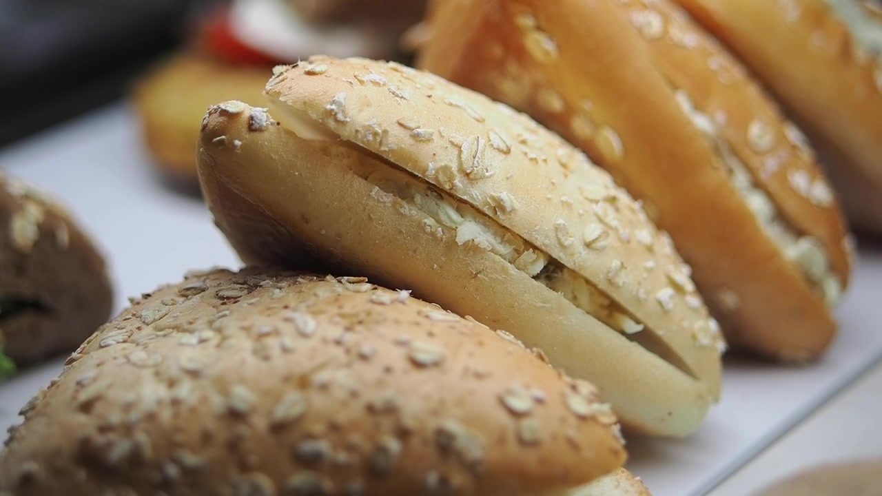 Freshly Prepared Sandwiches Displayed in a Bakery Showcase