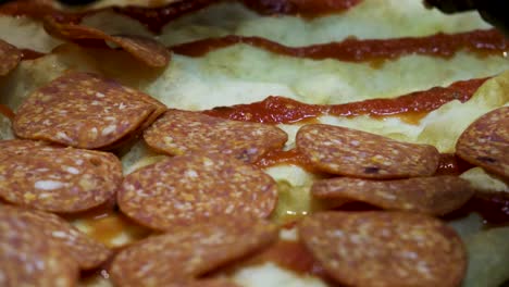 pepperoni pizza being prepared