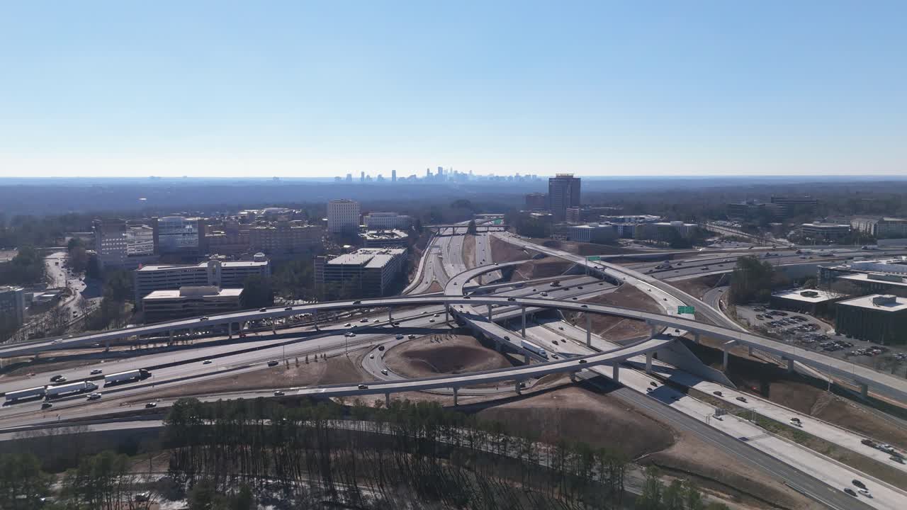 Aerial shot looking at Downtown Atlanta pulling back through The King and Queen Towers in Dunwoody.