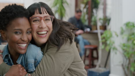 portrait of young woman suprise hugging friend diverse girlfriends embracing laughing enjoying friendship hang out together in urban background