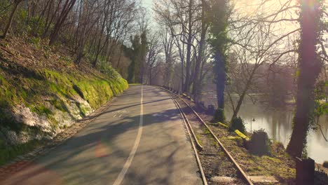 a road runs along an old railway line next to the saar river against the german-french border