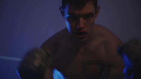 boxing fighter putting on mouth guard - close up