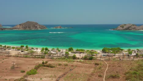 the white sand beach of tanjung aan in lombok, indonesia during a sunny day