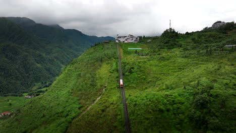 aerial view of cable car ascending lush green mountains in vietnam