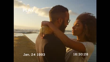 Animation-of-interference-over-african-american-couple-at-beach