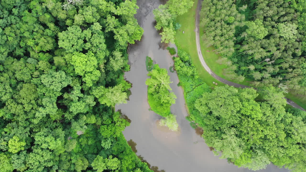 Aerial Shot Of A River Surrounded By A Hiking Trail And Trees At Beavercreek, Ohio