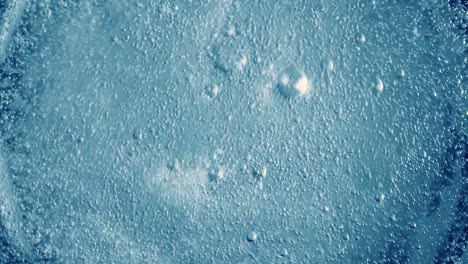 oxygen bubbles in water on a blue abstract background