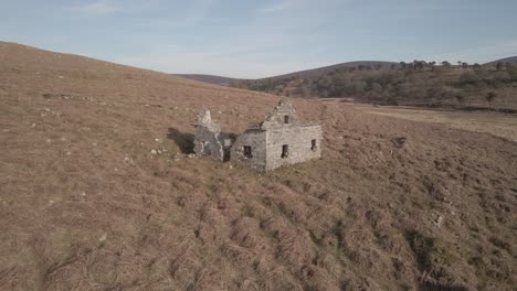 exterior of old and abandoned building on hill of wicklow mountains during summer in ireland