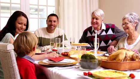 three generation family having christmas dinner together