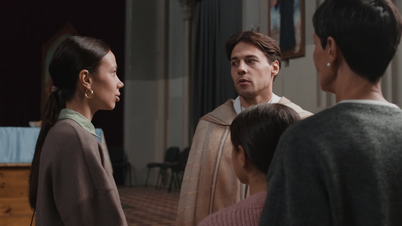 Priest speaking to congregation in a church