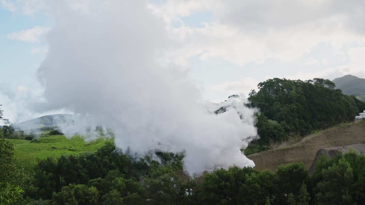 Azores' Green Landscape: Large Steam Cloud on Hillside