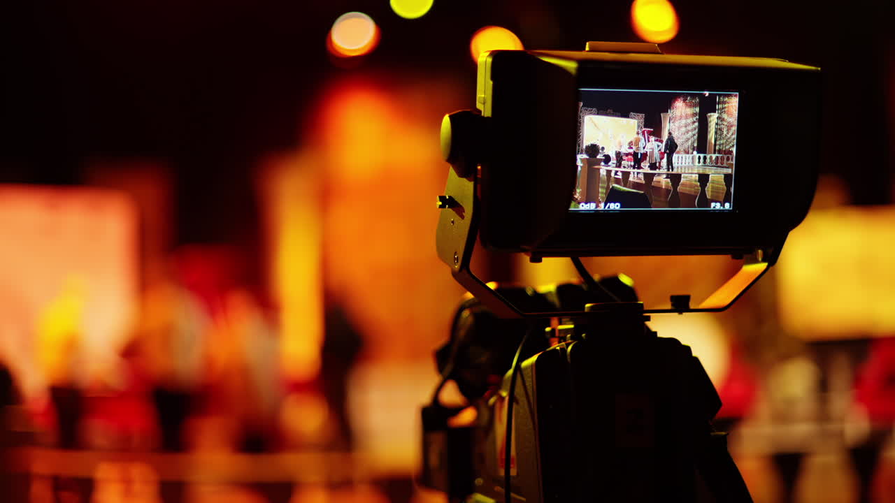 Professional camera filming with on the backstage of a TV set