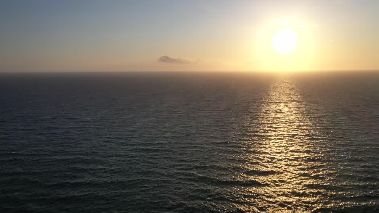 Vibrant Sunlight Over Glistening Water At The Pacific Ocean During Sunset