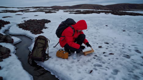 arctic researcher observing snow and ice