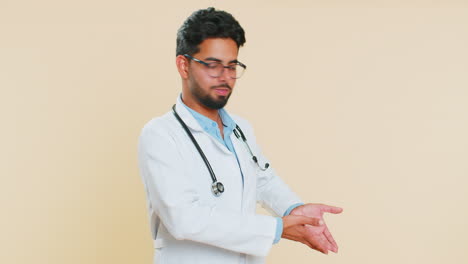 Indian-doctor-man-raising-hands-asking-what-why-reason-of-failure-disbelief-irritation-by-troubles