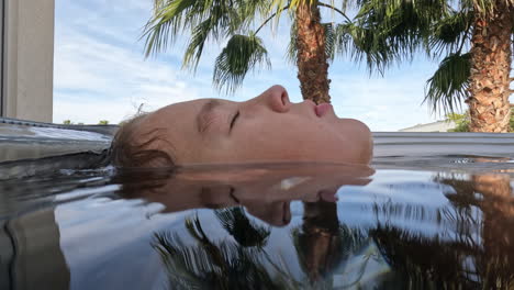 boy enjoying warm hot tub