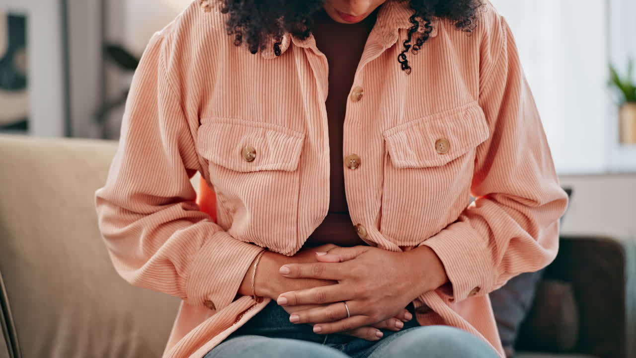 Woman experiencing stomach pain